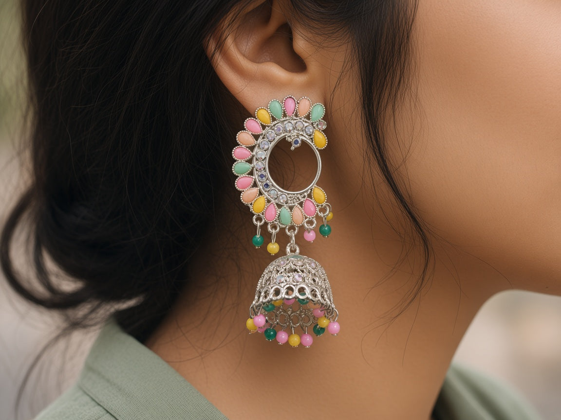 Mayur pastel chandbali jhumkas worn on the ear