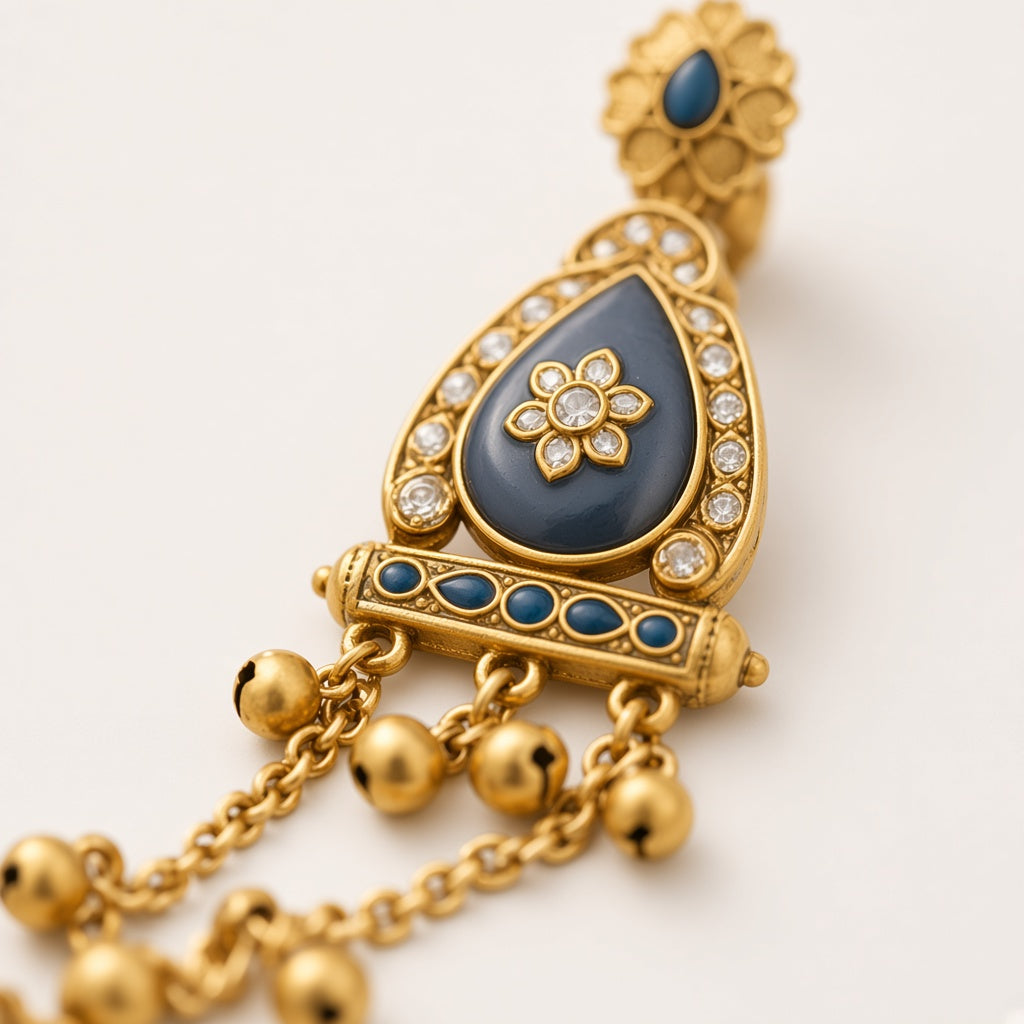 Neelam Kashmiri earring, close-up of the slate-blue enamel teardrop and kundan flower