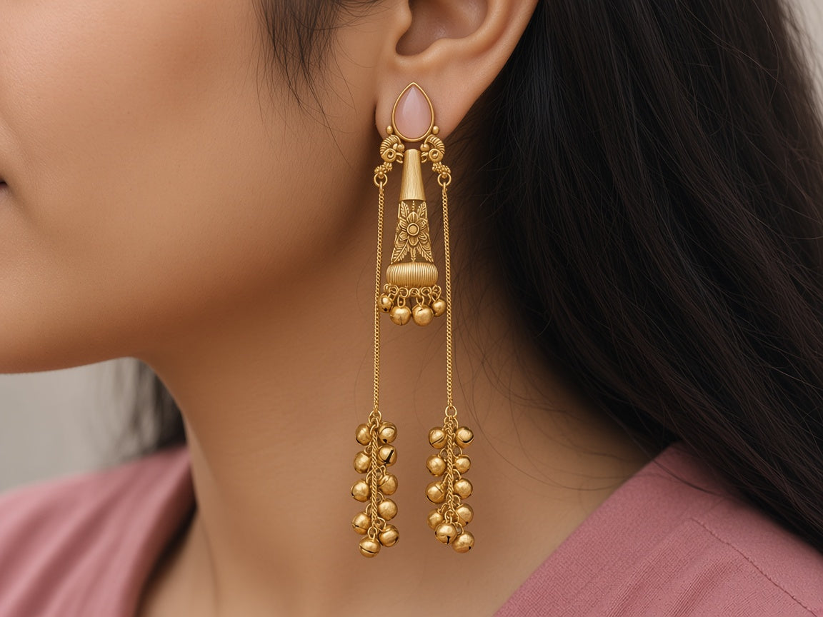Nupur Blush Pink ghungroo chain earrings worn on the ear