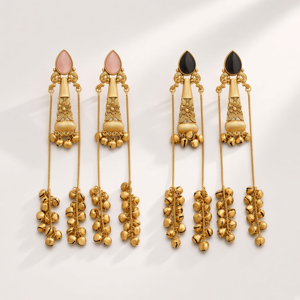 Nupur long ghungroo chain earrings in Blush Pink and Onyx Black, studio shot on cream background