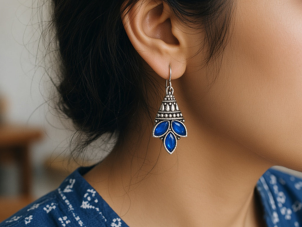 Parna blue leaf drop earring worn on the ear
