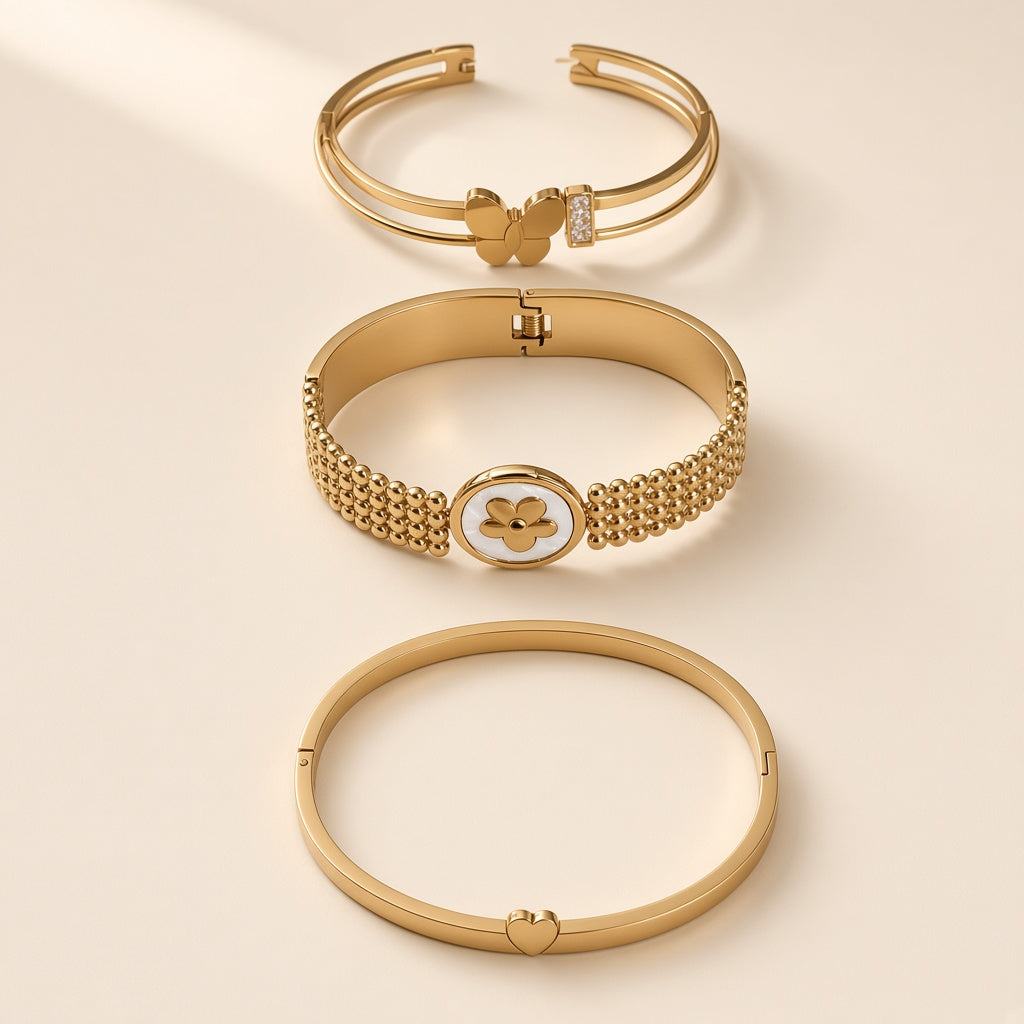 Sakhi gold-tone hinged bangles in Butterfly, Clover Mesh and Heart styles, studio shot