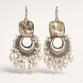 Seep silver-tone pearl chandbali earrings with baroque shell-look top and pearl fringe, studio shot