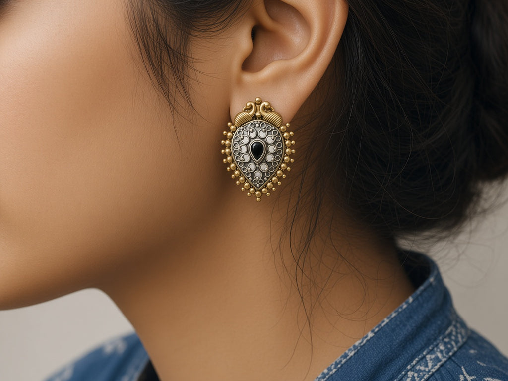 Shyama oxidised peacock stud worn on the ear