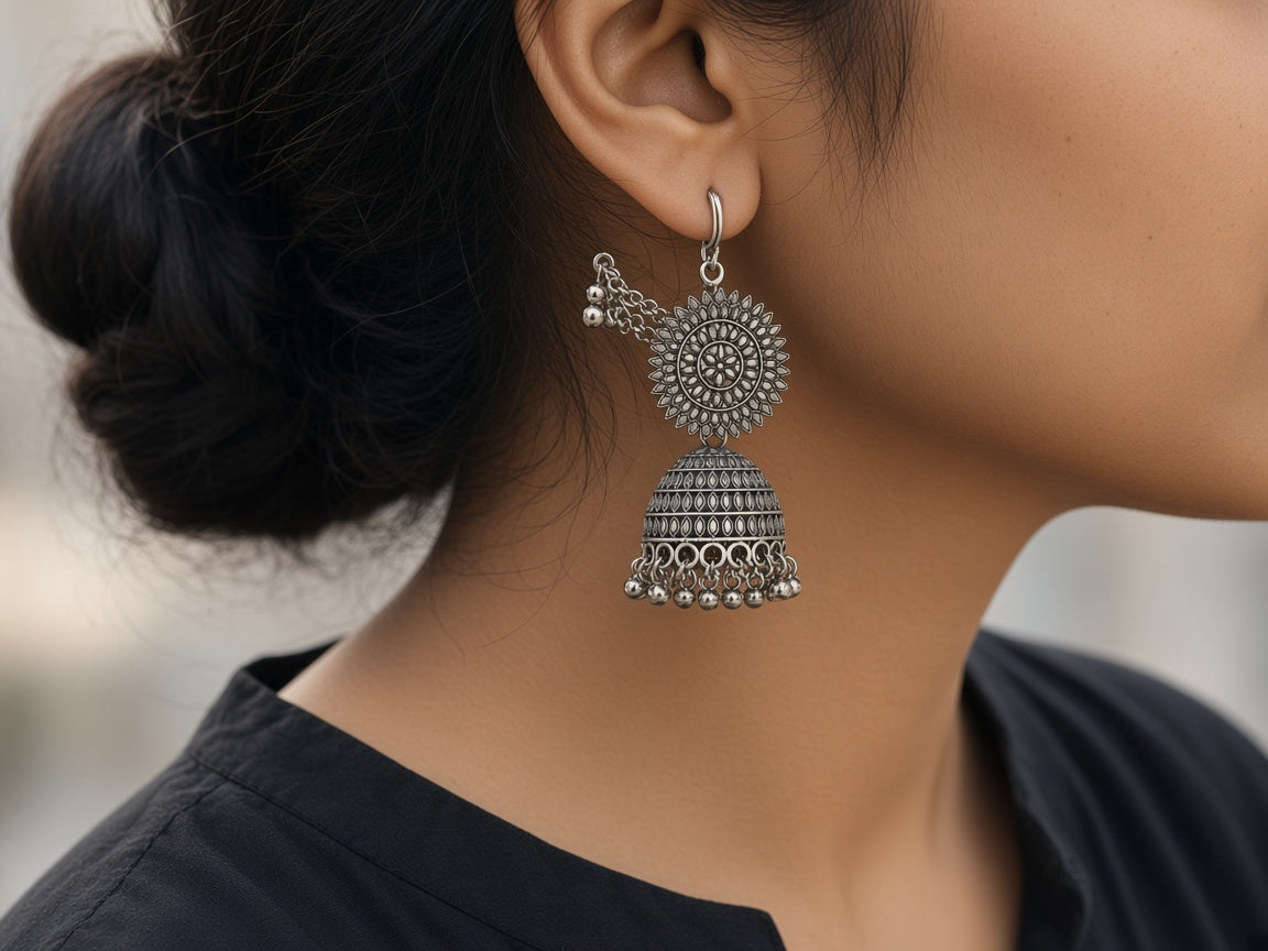 Surya oxidised silver jhumka with ear-chain worn on the ear