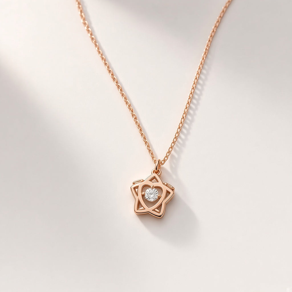 Tara rose-gold-tone open star pendant necklace with floating cubic zirconia, studio shot