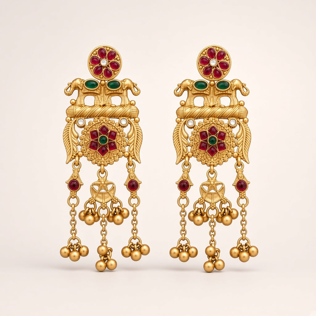 Utsav matte gold-tone temple earrings with rani-pink and green stones, twin elephants and ghungroo drops, studio shot